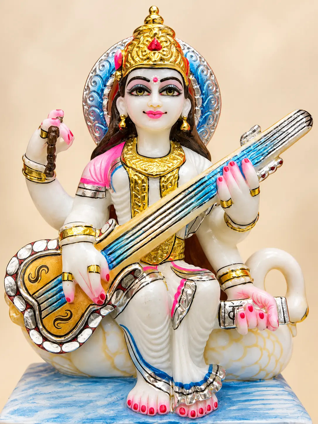 Maa Saraswati marble murti — crown, veena and swan detail